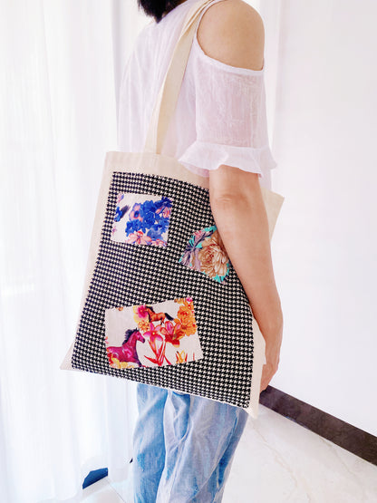 Canvas tote bag carrying books, perfect for students or literary fans.