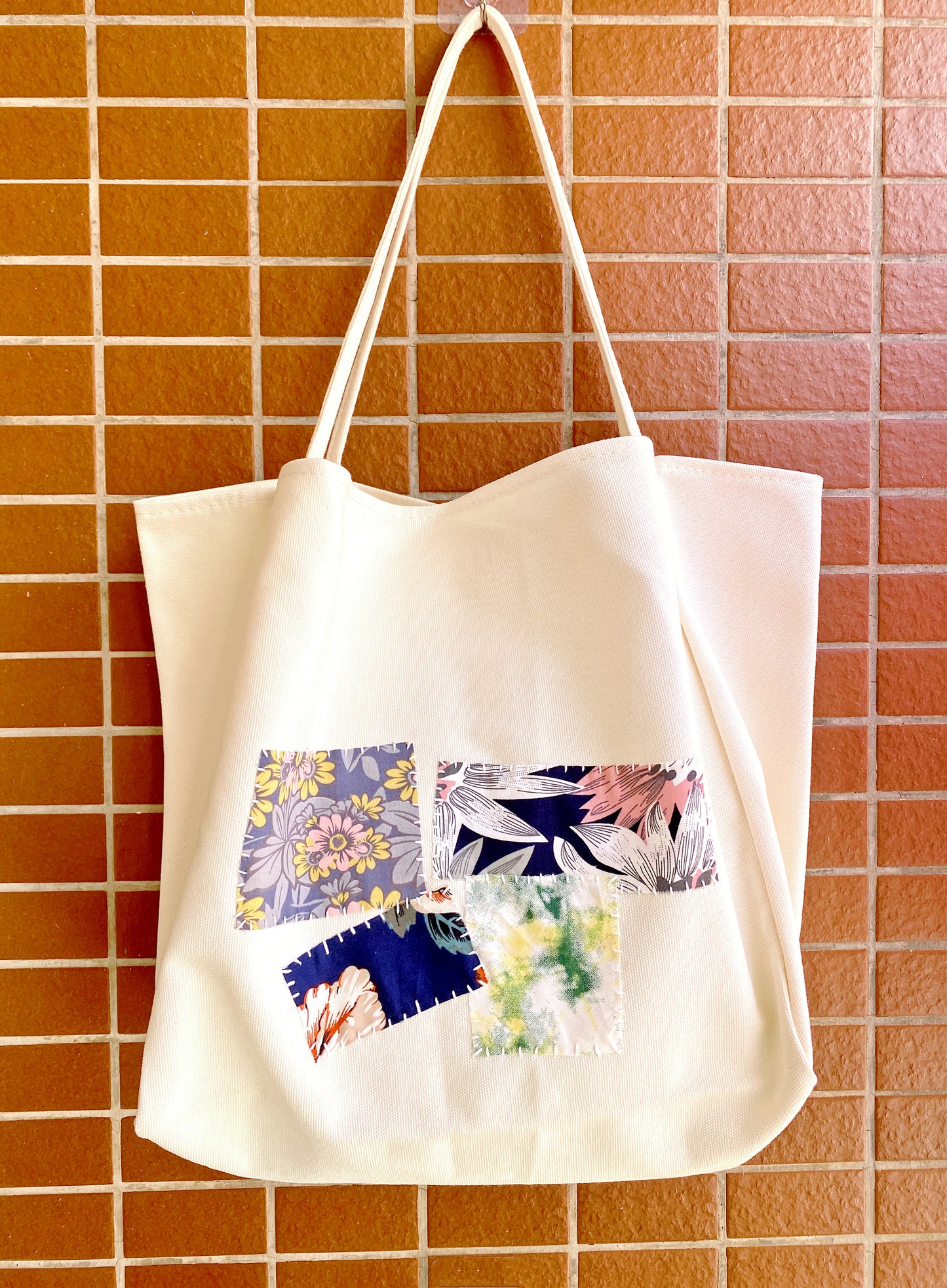 Daily-use bag placed beside a coffee table in natural light