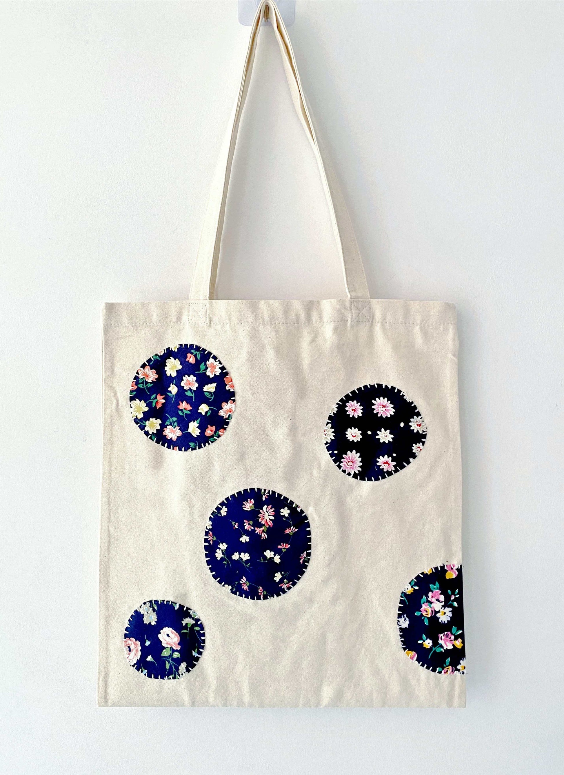 Tactile detail of the reinforced seams, proving the bag's long-term durability despite its surprisingly soft feel.