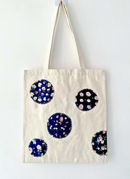 Tactile detail of the reinforced seams, proving the bag's long-term durability despite its surprisingly soft feel.