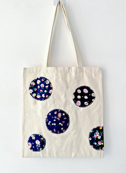 Tactile detail of the reinforced seams, proving the bag's long-term durability despite its surprisingly soft feel.