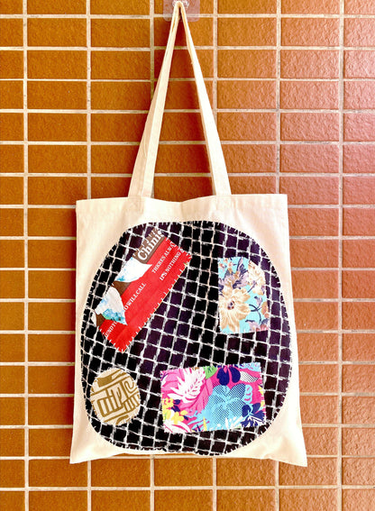 Choosing a gift that tells a story: this lightweight fabric tote features intricate patches favored by the Reddit slow-fashion community.