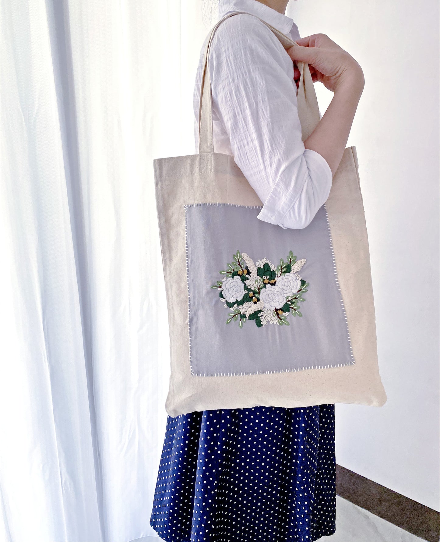A beautifully hand-embroidered floral tote bag crafted from durable, eco-friendly cotton canvas. Ideal for those who value sustainability and artistry.