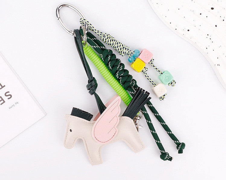 Playful horse purse charm showcasing a hand-braided cord element