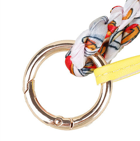 Custom horse keyring accessory attached to a leather crossbody bag for daily wear