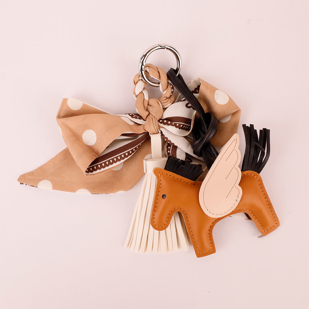Khaki scarf bow decoration for a leather handbag