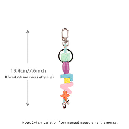 Custom letter phone charm dangling from phone case