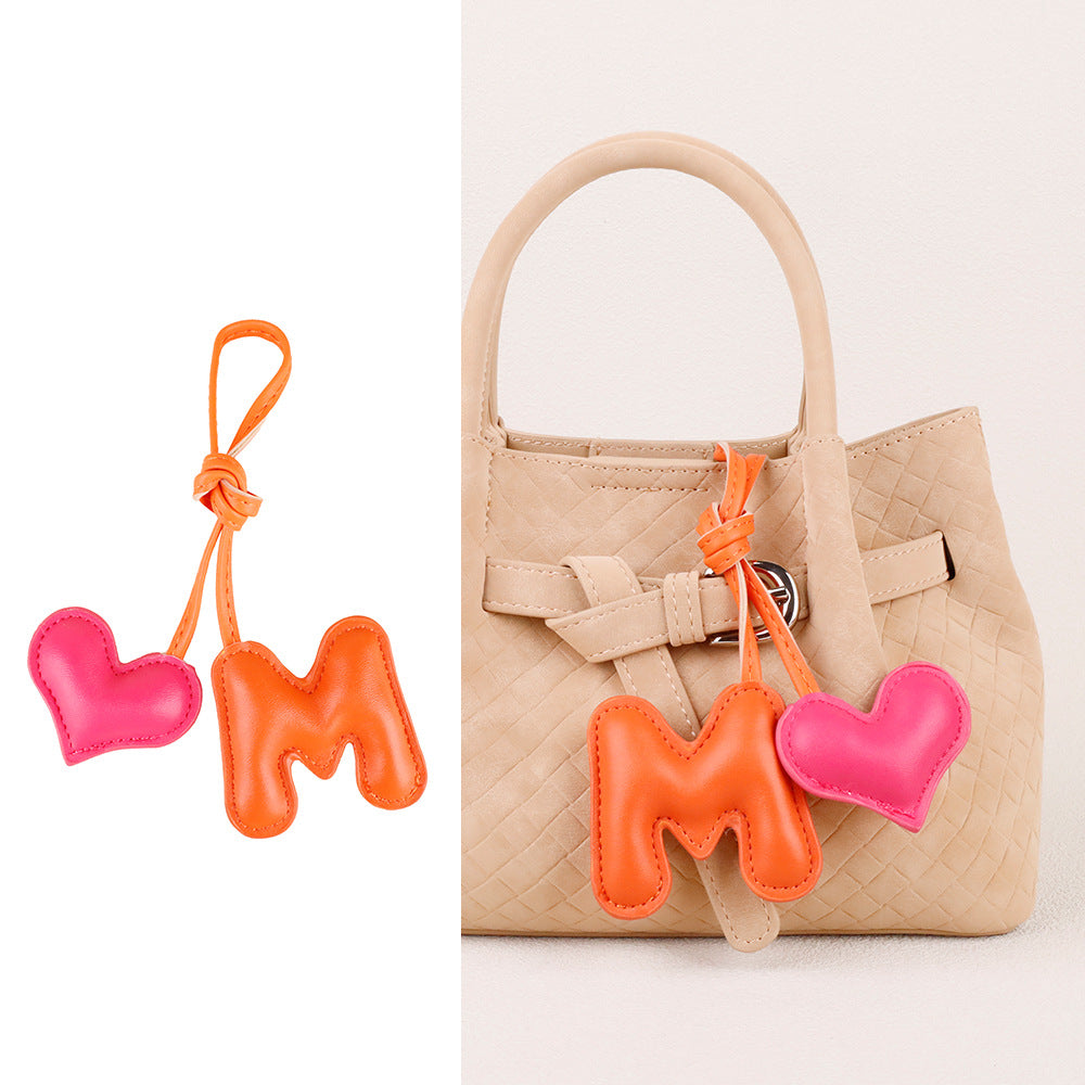 Stuffed heart bag ornament with a playful letter