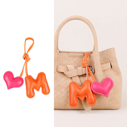 Stuffed heart bag ornament with a playful letter