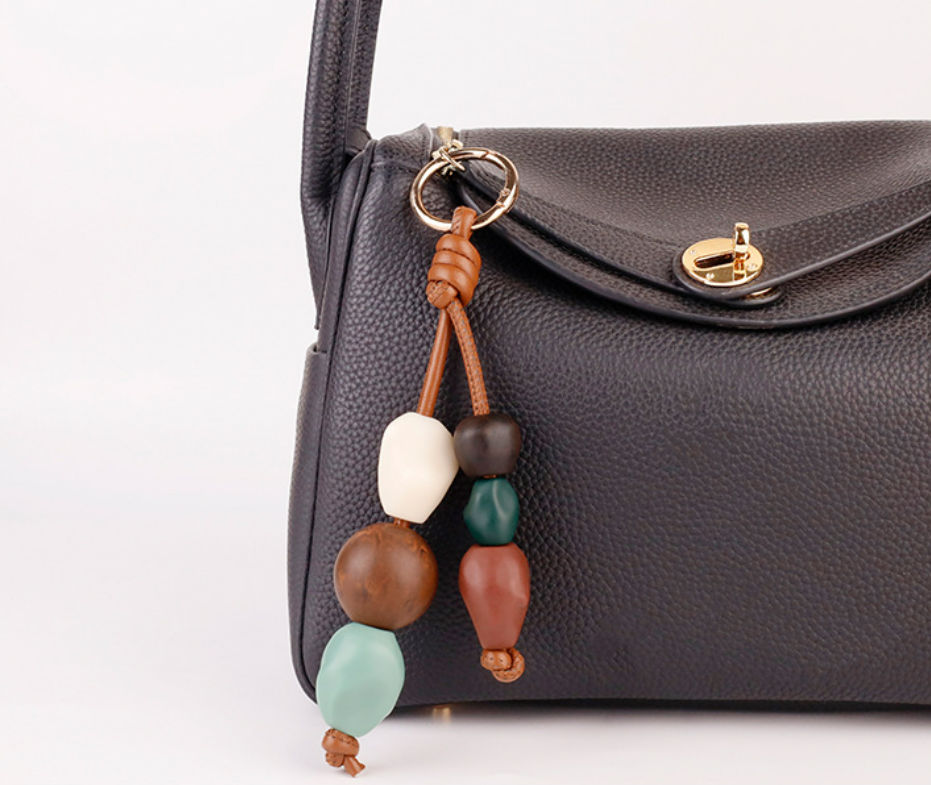 Colorful ceramic beads arranged as a decorative bag accessory