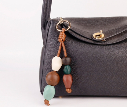 Colorful ceramic beads arranged as a decorative bag accessory