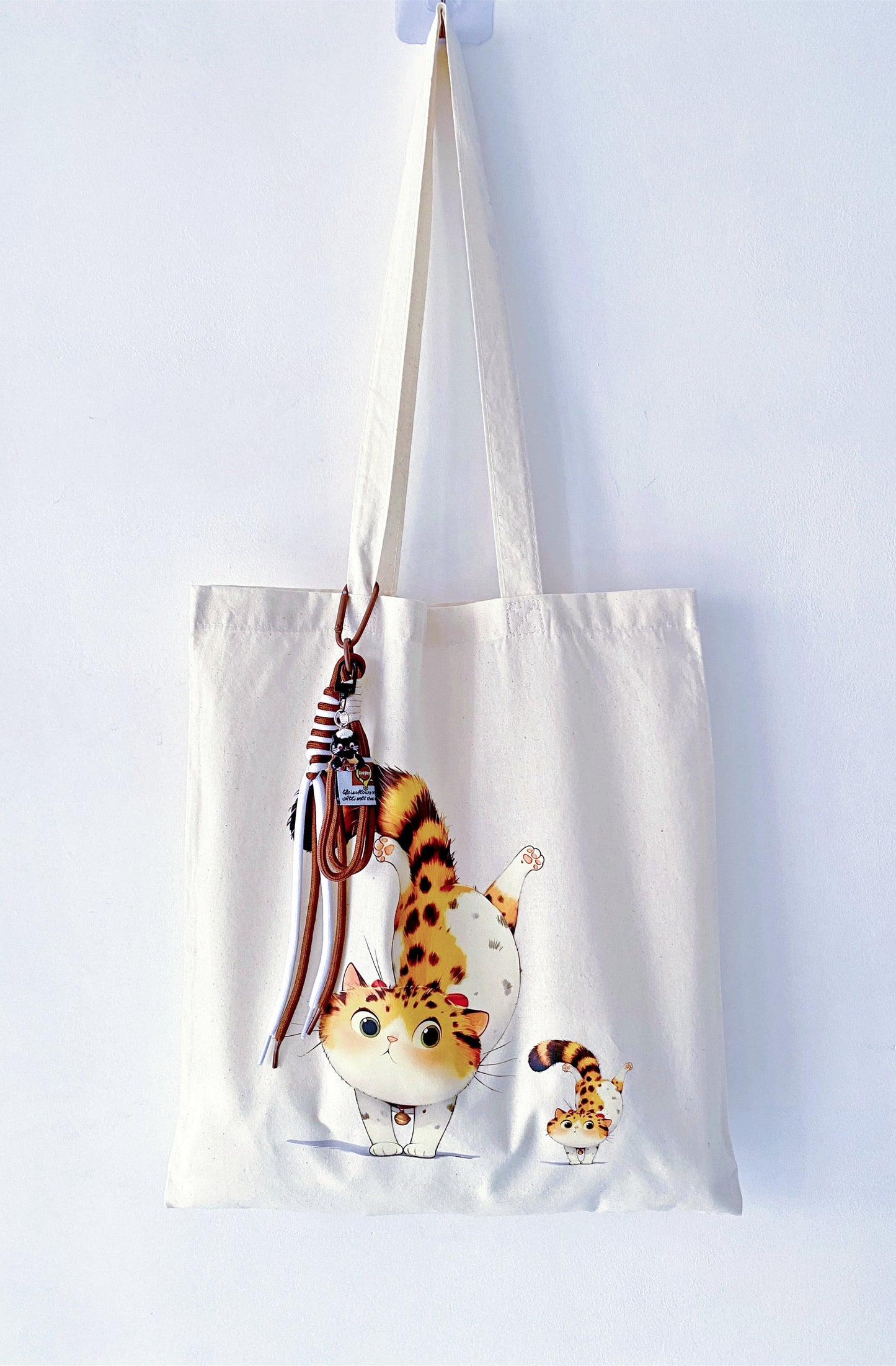 Soft minimal lifestyle bag with a charming hand-inked kitten pattern.