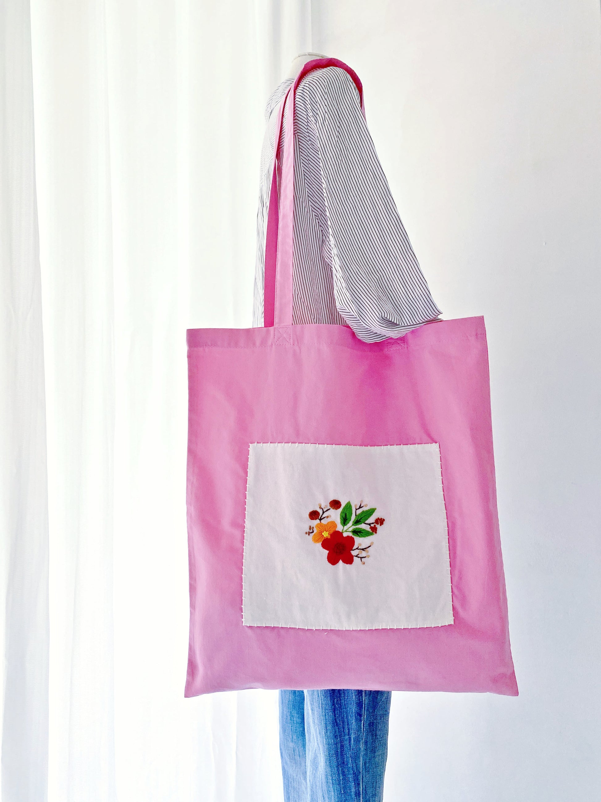 Creative pink tote bag with a unique floral pattern design