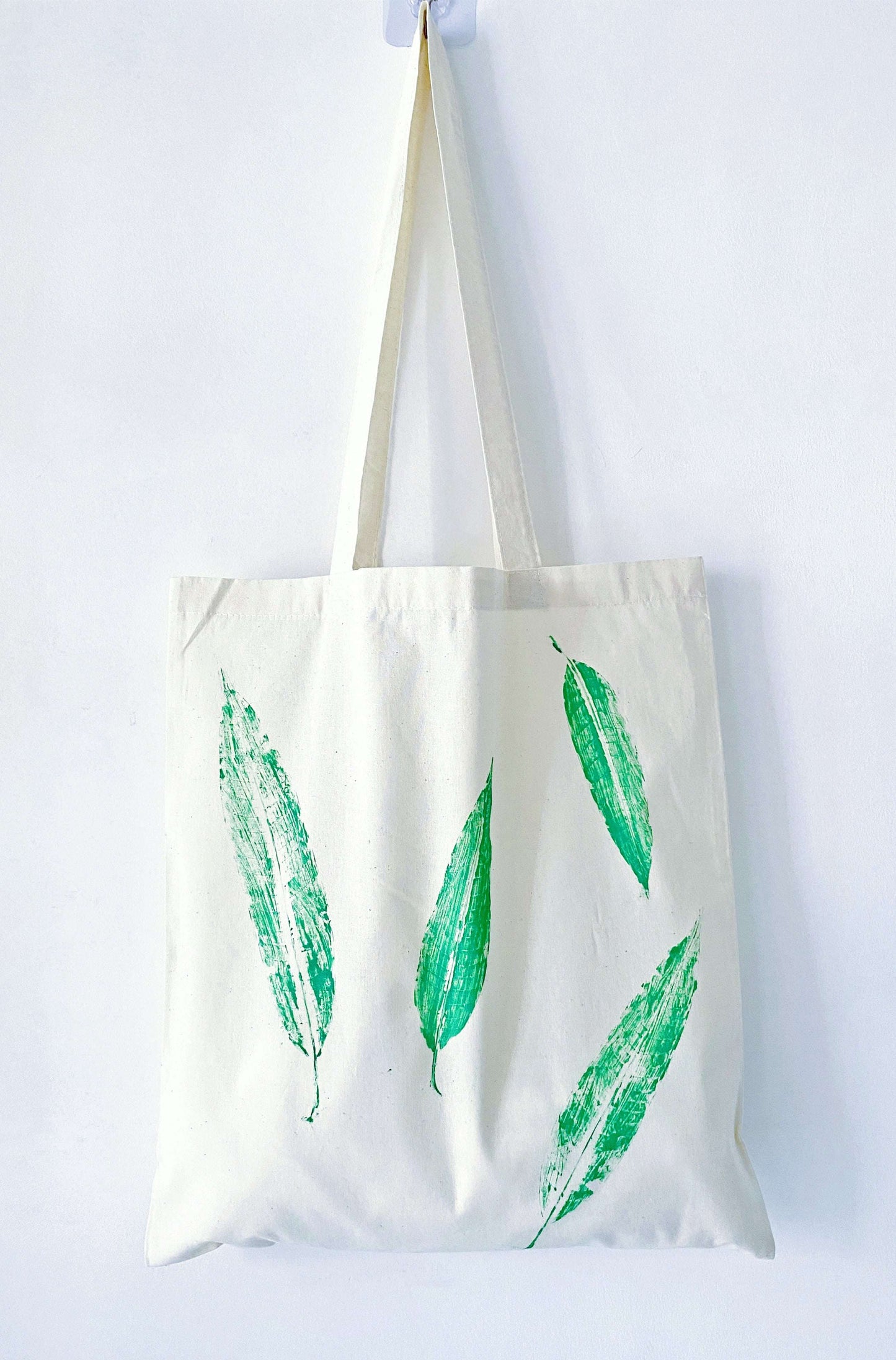 Hand-printed leaf design on soft cotton, an ideal gift for someone who loves sustainable style and natural beauty.