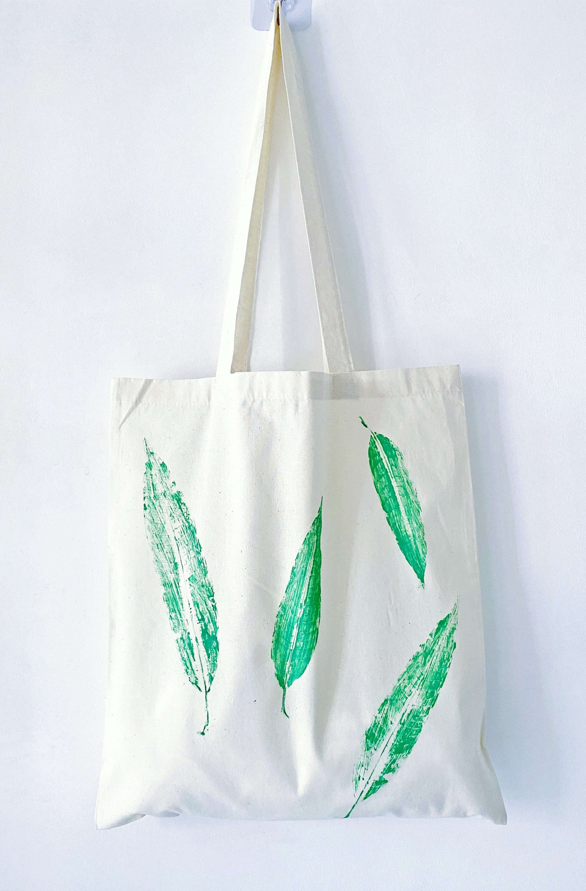 Hand-printed leaf design on soft cotton, an ideal gift for someone who loves sustainable style and natural beauty.