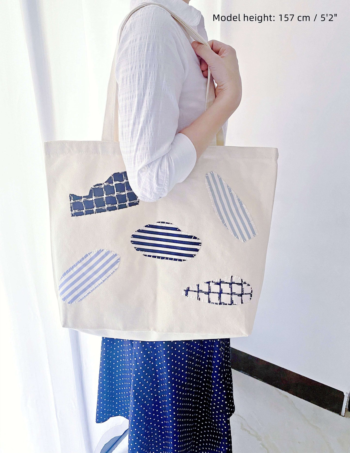 Crafted from organic canvas, this spacious tote is a perfect fit for anyone leading a minimalist or sustainable lifestyle. The hand-stitched patchwork adds a personal touch.