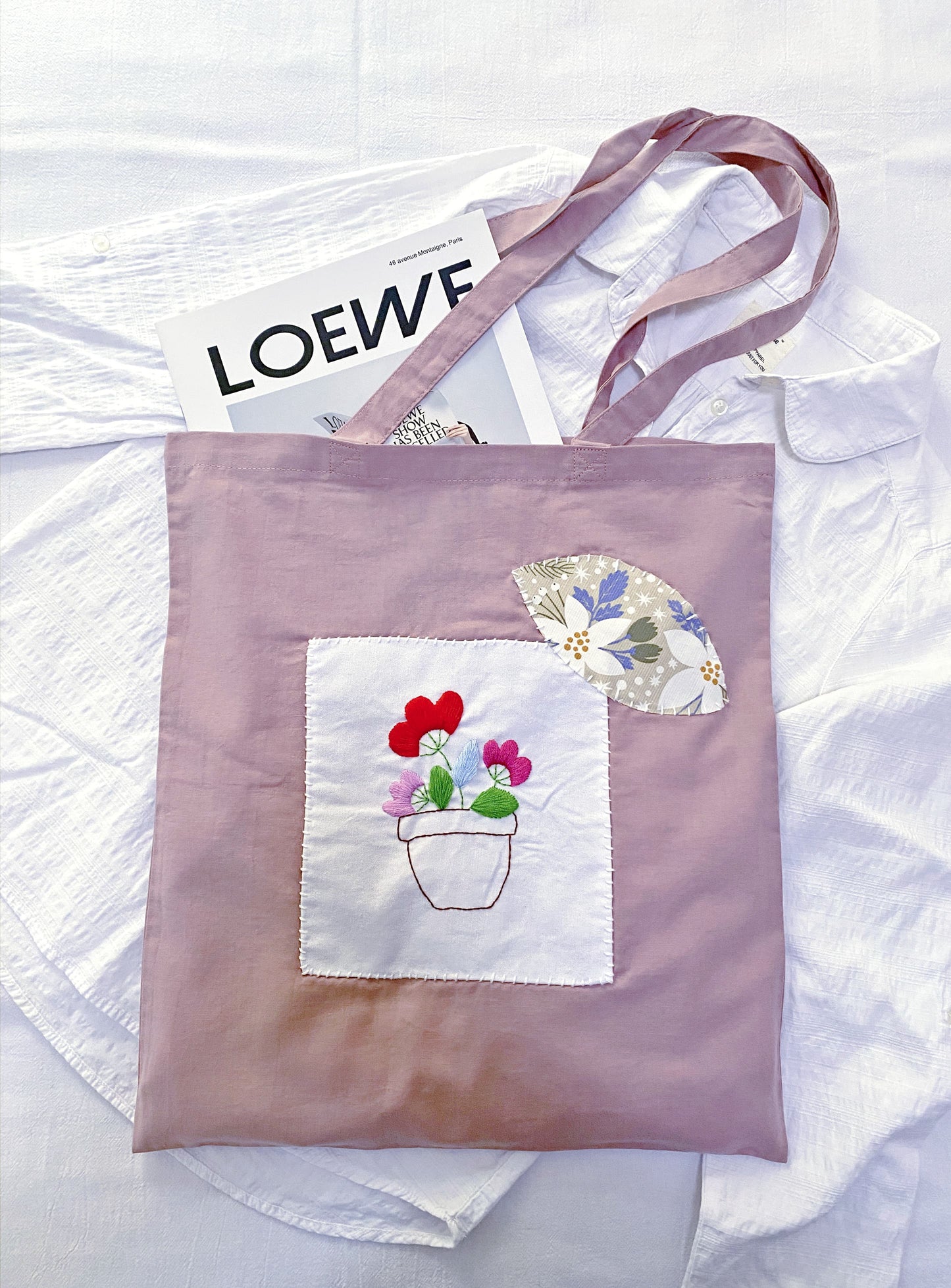 Gentle folds of ultra-thin durable cotton fabric on a sunny park bench.