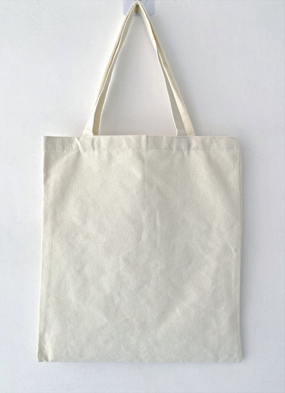 Relaxed fit canvas tote ideal for carrying books, groceries, and laptops.
