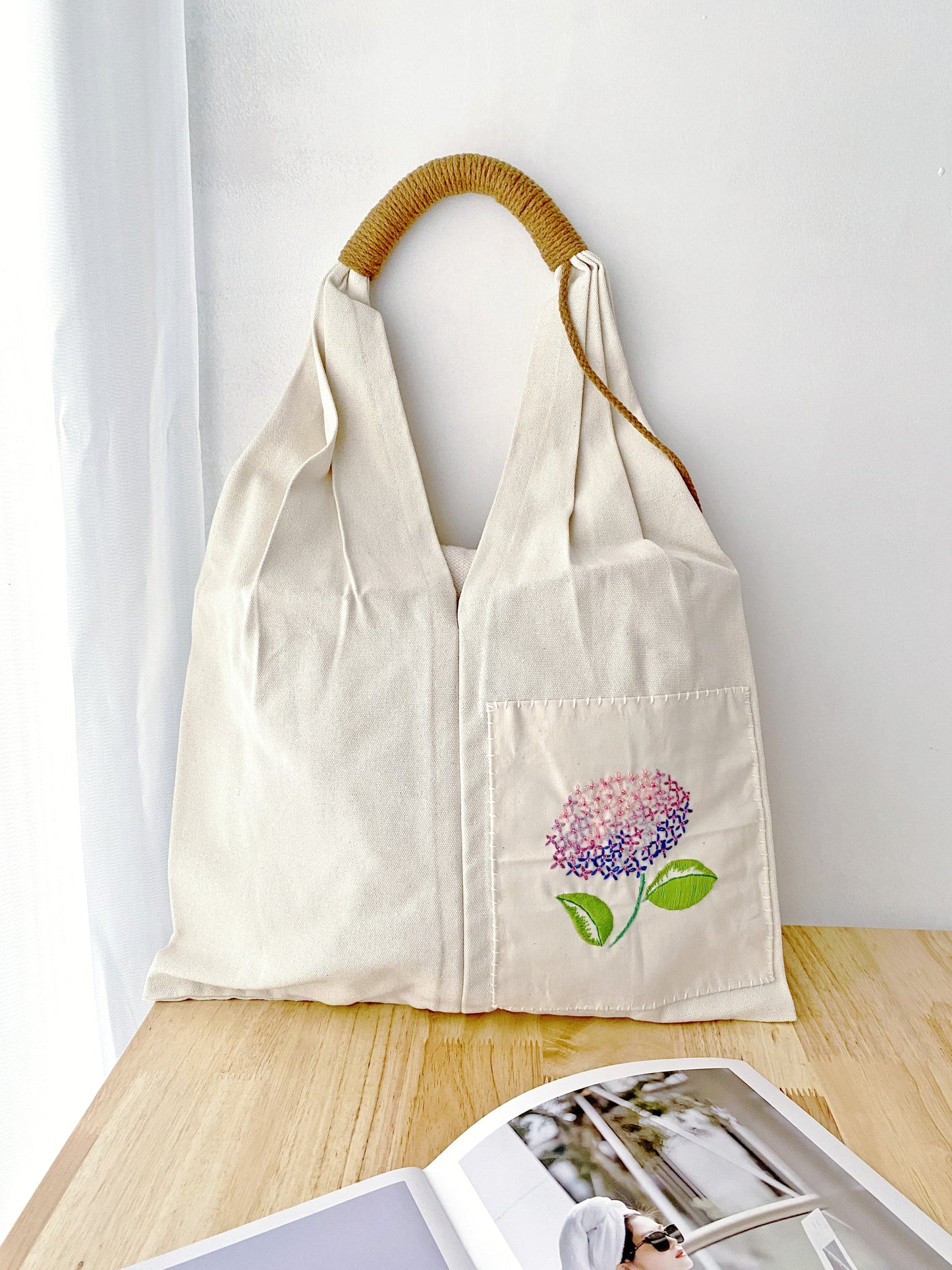 Durable canvas bag with floral design, perfect for minimalist fashion.
