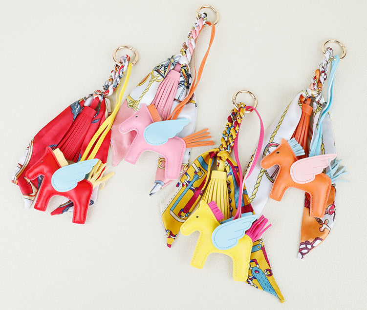 Hand-stitched horse ornament used as a minimalist luxury car rearview mirror hanging decor