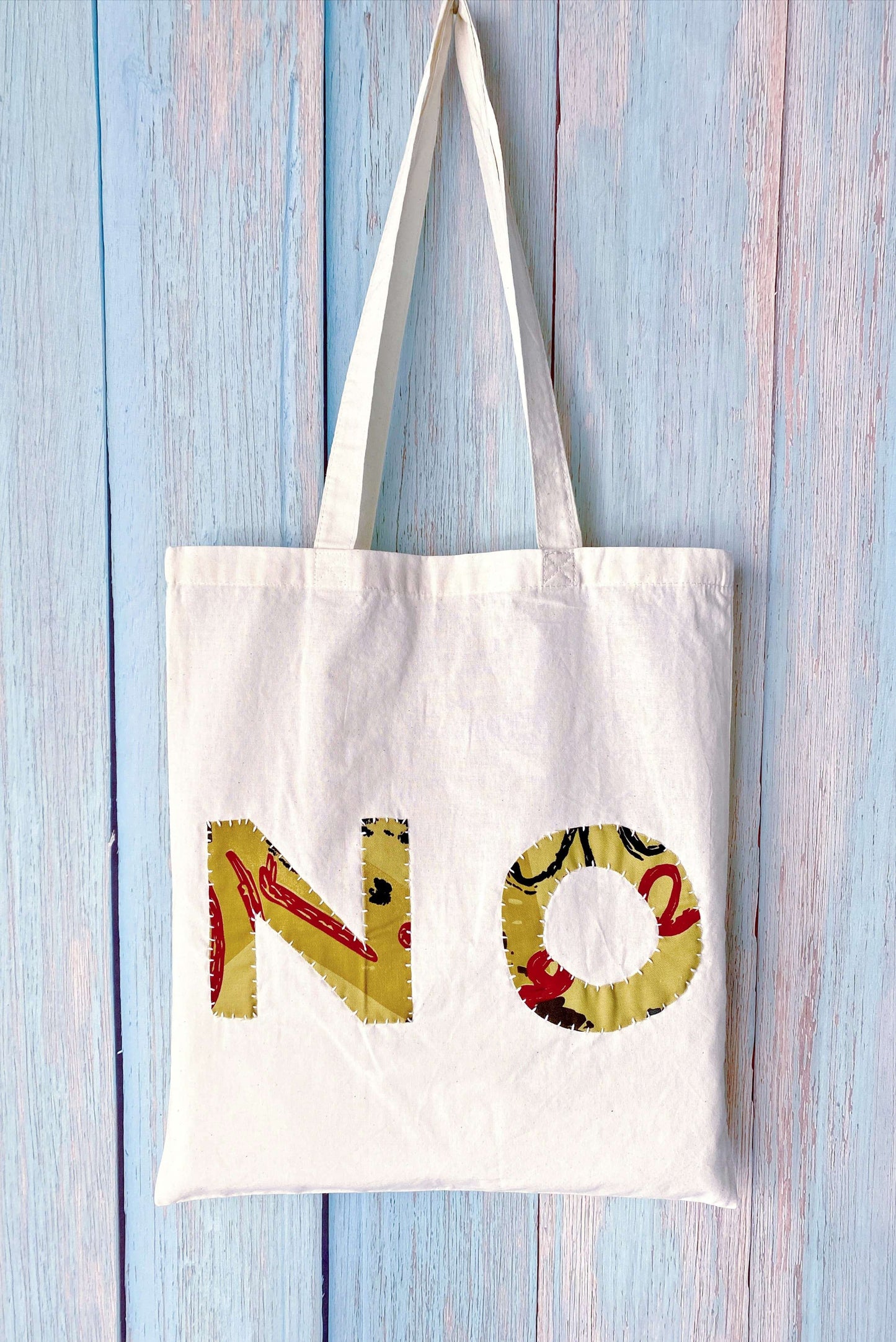 Artisan style textile tote highlighting raw edges and creative handwork meant for artistic souls and makers