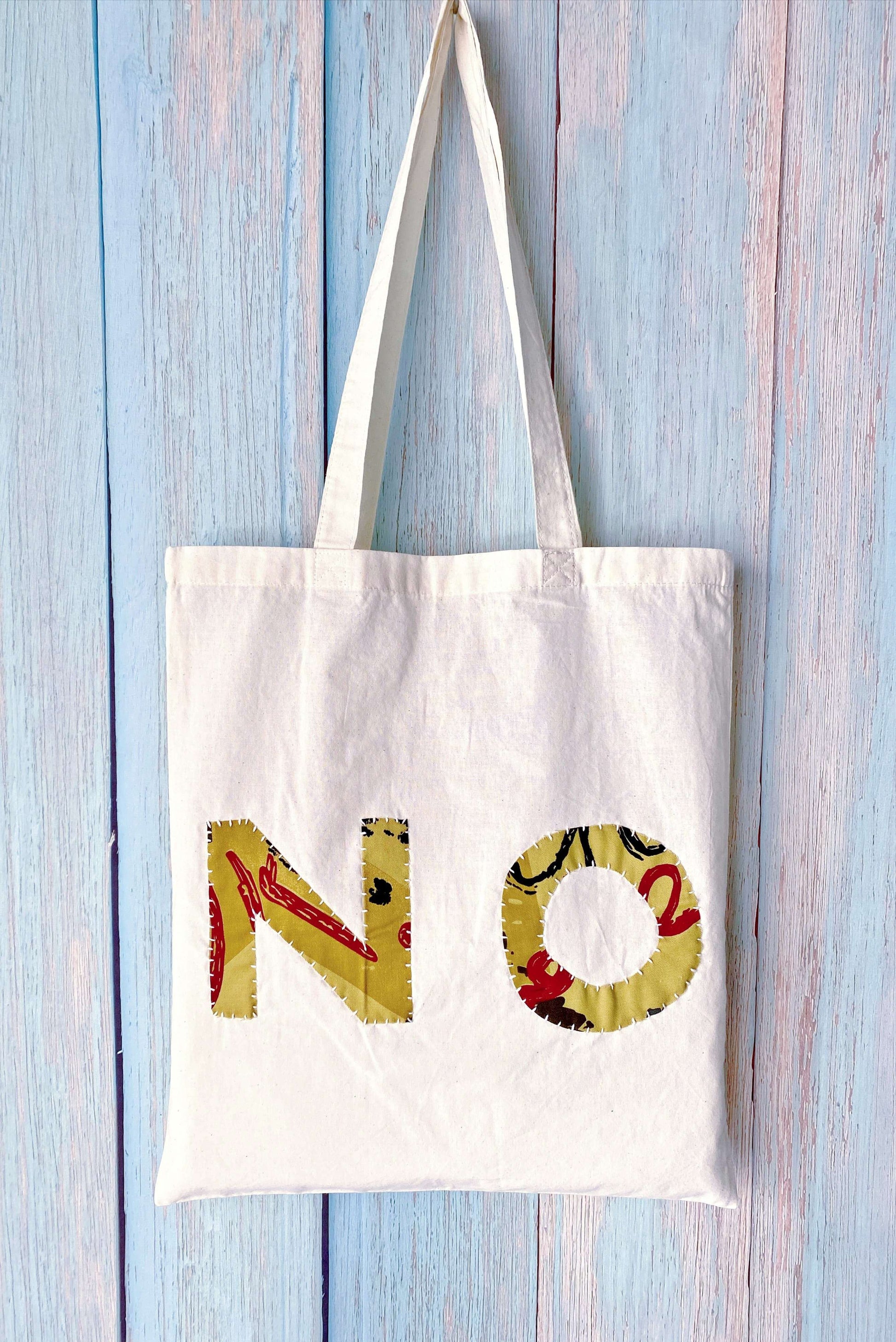 Artisan style textile tote highlighting raw edges and creative handwork meant for artistic souls and makers