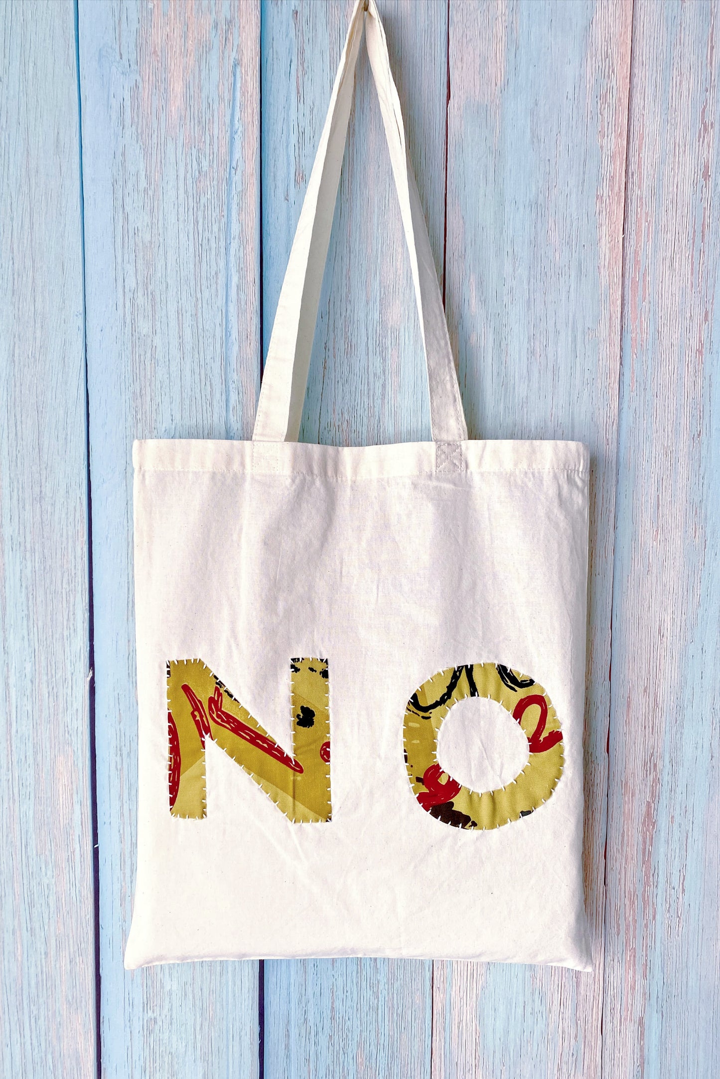 Artisan style textile tote highlighting raw edges and creative handwork meant for artistic souls and makers