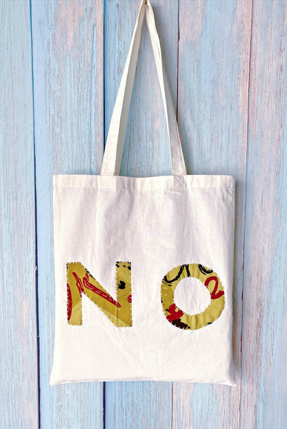 Artisan style textile tote highlighting raw edges and creative handwork meant for artistic souls and makers