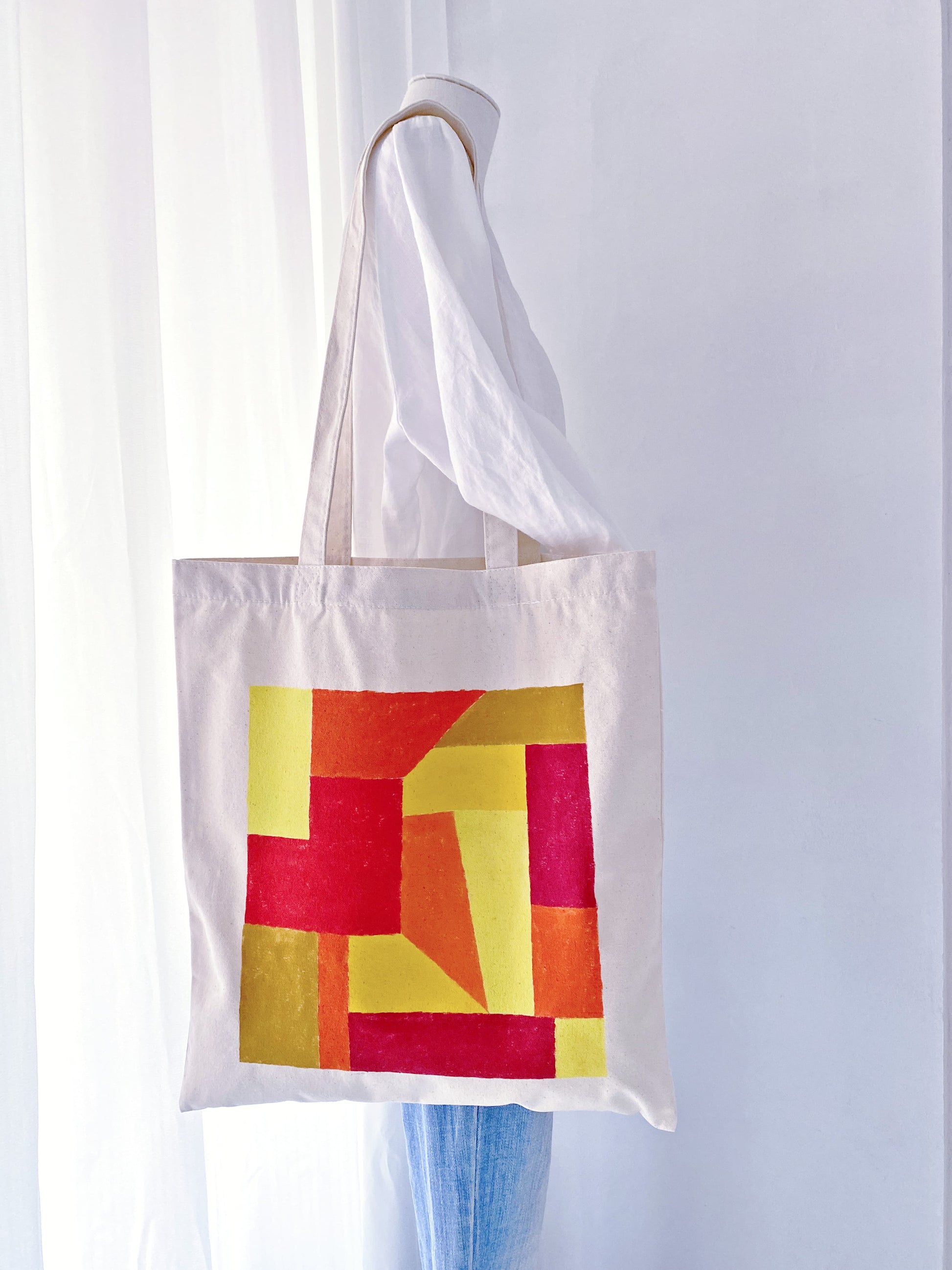 Minimalist aesthetic outfit featuring a large hand-decorated cotton shoulder bag.