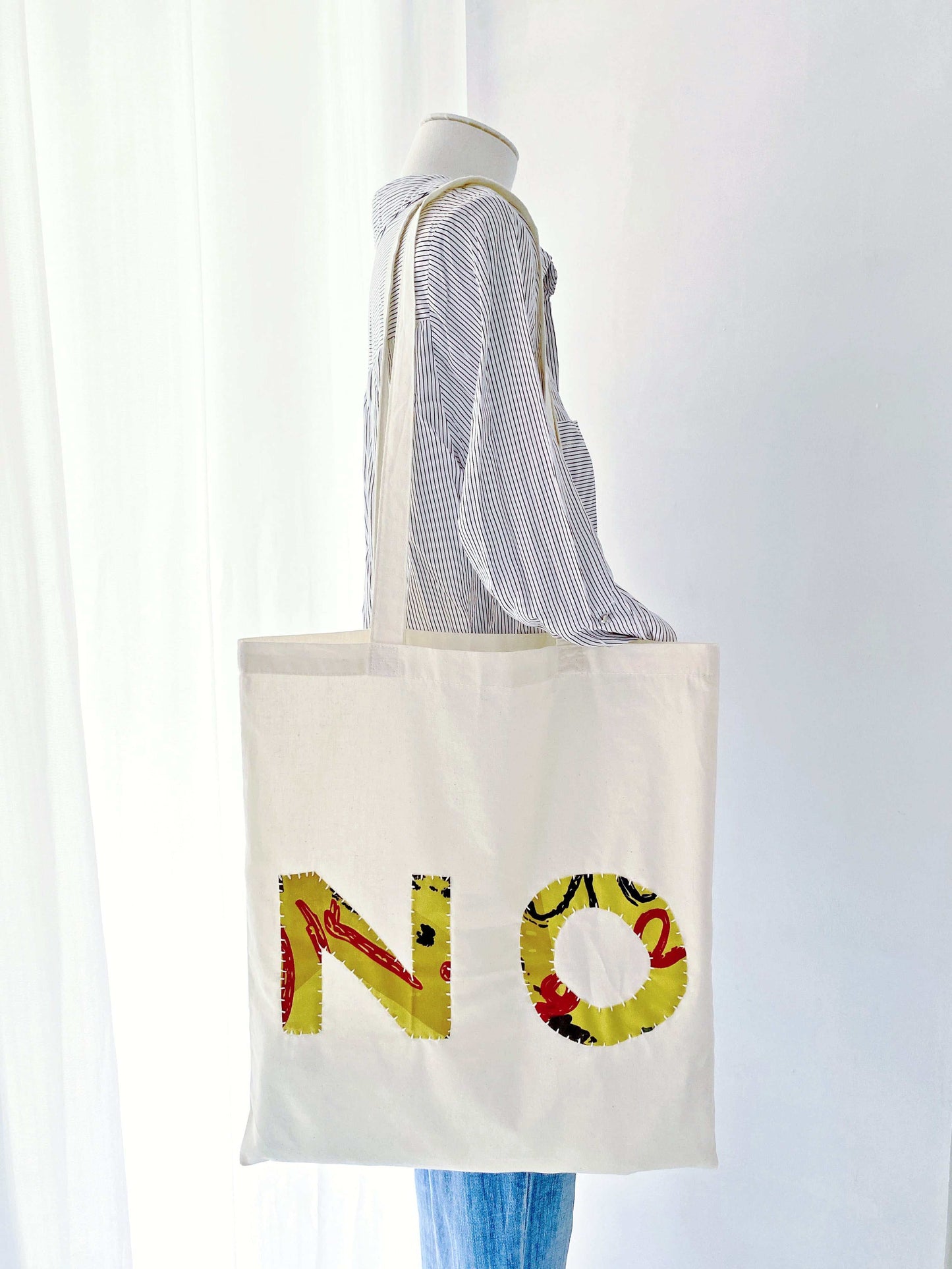 Hand-sewn fabric tote, answering "What are the best natural materials shopping bags?".
