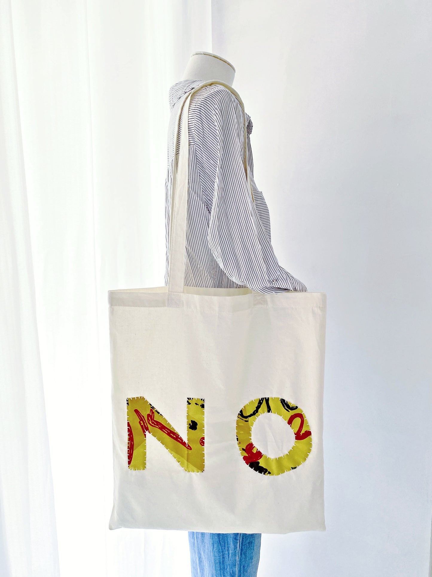 Hand-sewn fabric tote, answering "What are the best natural materials shopping bags?".