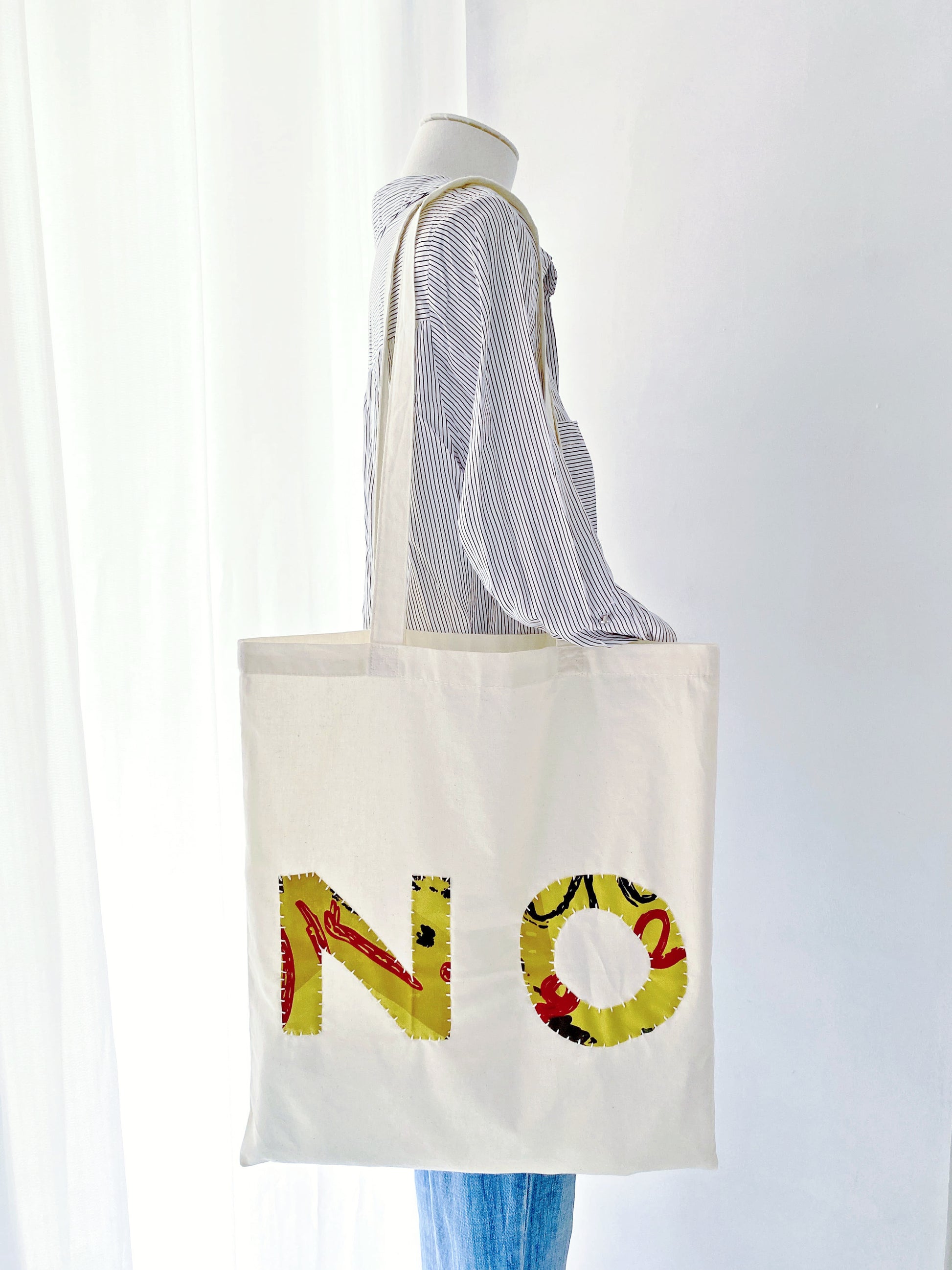 Hand-sewn fabric tote, answering "What are the best natural materials shopping bags?".