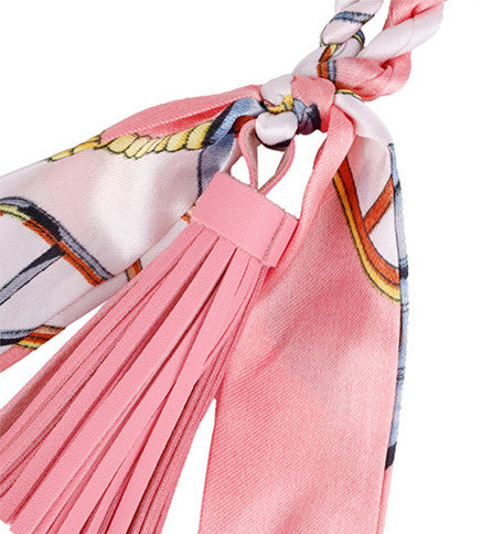 Giraffe figure with fabric scarf and soft tassel