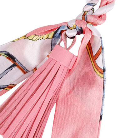 Giraffe figure with fabric scarf and soft tassel