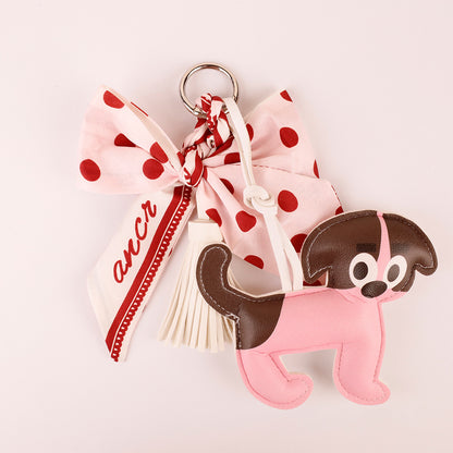 Pink polka dot accessory for a shoulder bag