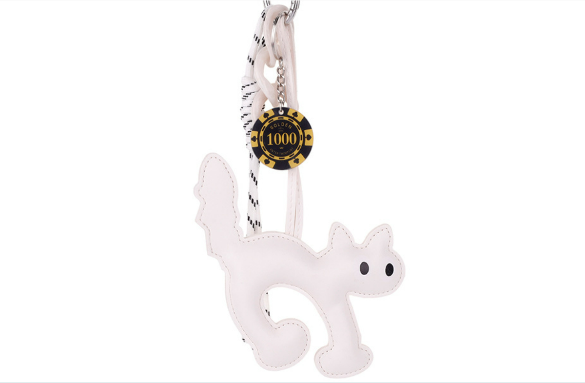 Adorable resin kitty purse pendant styled on a minimalist handbag zipper