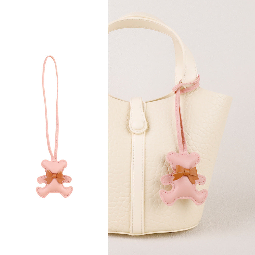 Handcrafted accessory for handbags showing a teddy bear with mini tassel