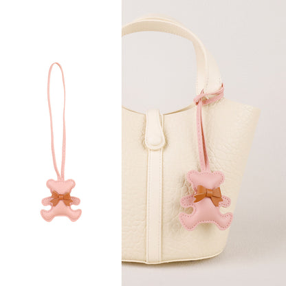 Handcrafted accessory for handbags showing a teddy bear with mini tassel