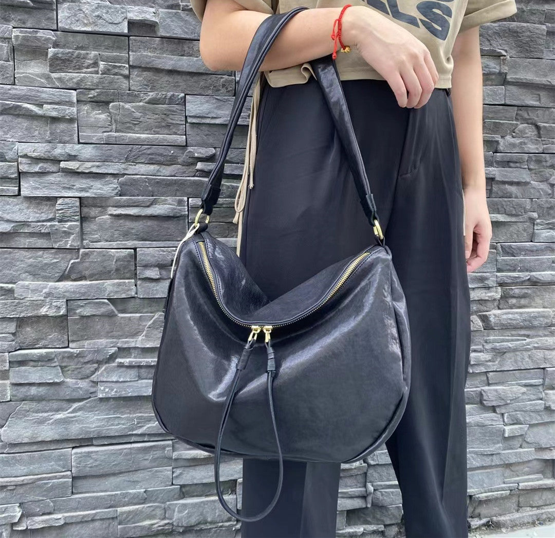 Genuine Leather Satchel Bag with Adjustable Strap and Unique Zipper Design