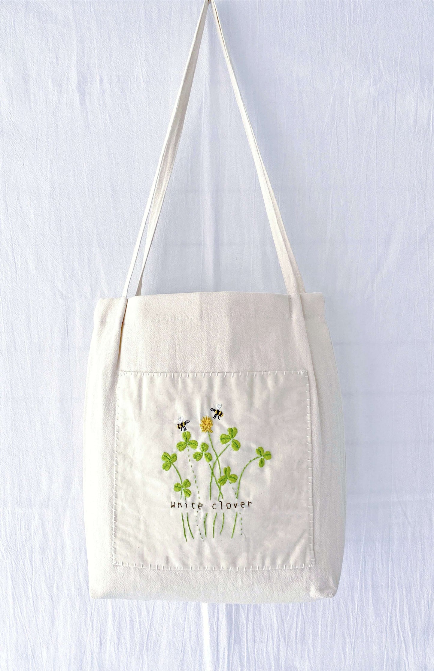 Hand-embroidered floral tote bag in eco-friendly cotton-linen – a perfect gift for nature lovers.
