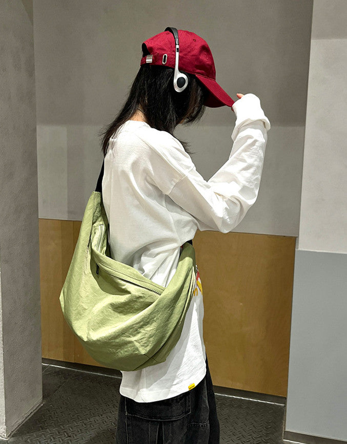 Soft unstructured everyday messenger bag fitting small tablet