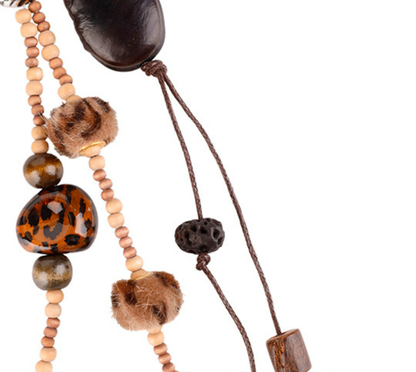 Wooden bead tassel accessory for a handbag