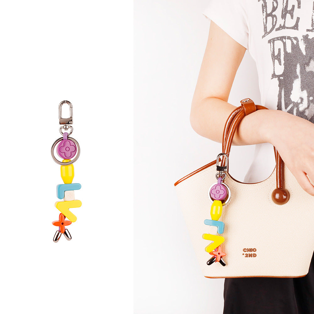 Aesthetic resin initial pendant for commuter tote bag