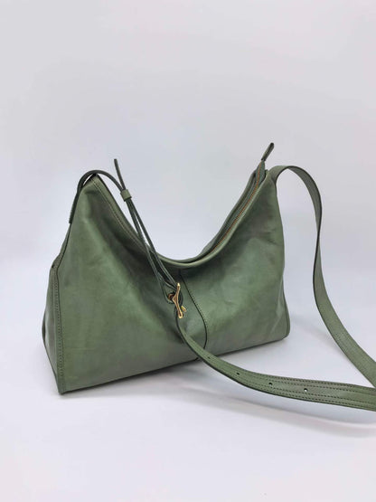 Adjustable strap leather bag worn crossbody for hands-free errands