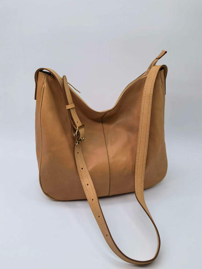 Classic leather purse styled for an outdoor lunch on a day off