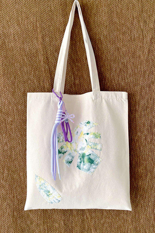 canvas tote bag with stitched patchwork design detail