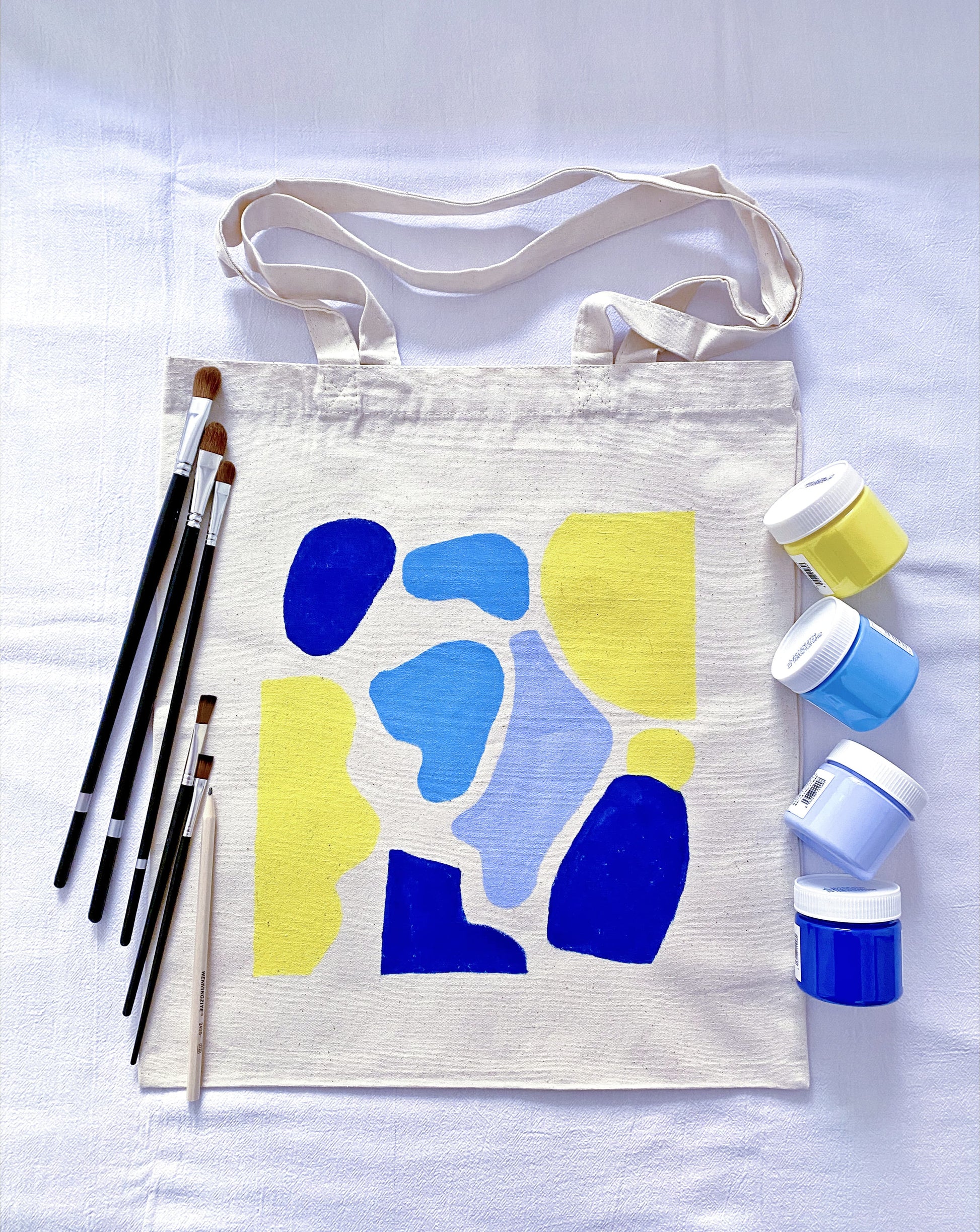 roomy everyday tote made from cotton canvas with a small artistic drawing