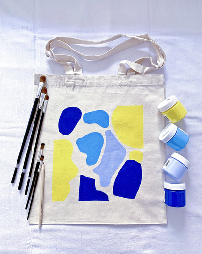 roomy everyday tote made from cotton canvas with a small artistic drawing