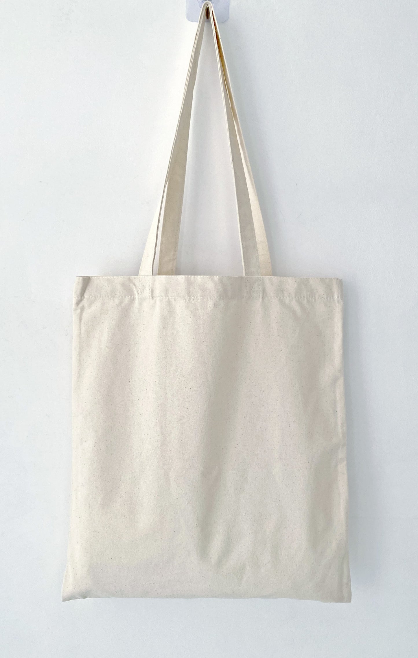 Soft cotton tote featuring an original handprinted bunny design for relaxed everyday errands