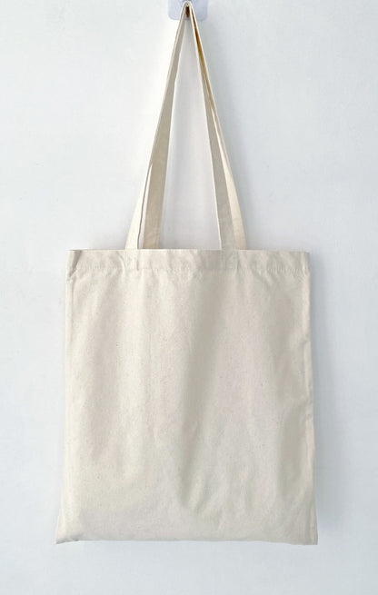 Soft cotton tote featuring an original handprinted bunny design for relaxed everyday errands
